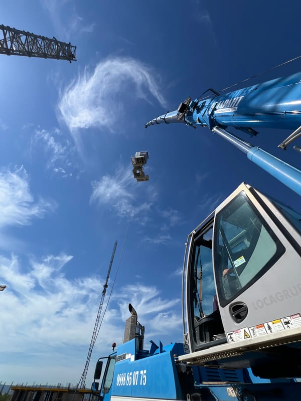 Blue crane on a Varna construction site, clear summer sky