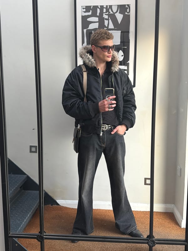Young man poses for mirror selfie in London