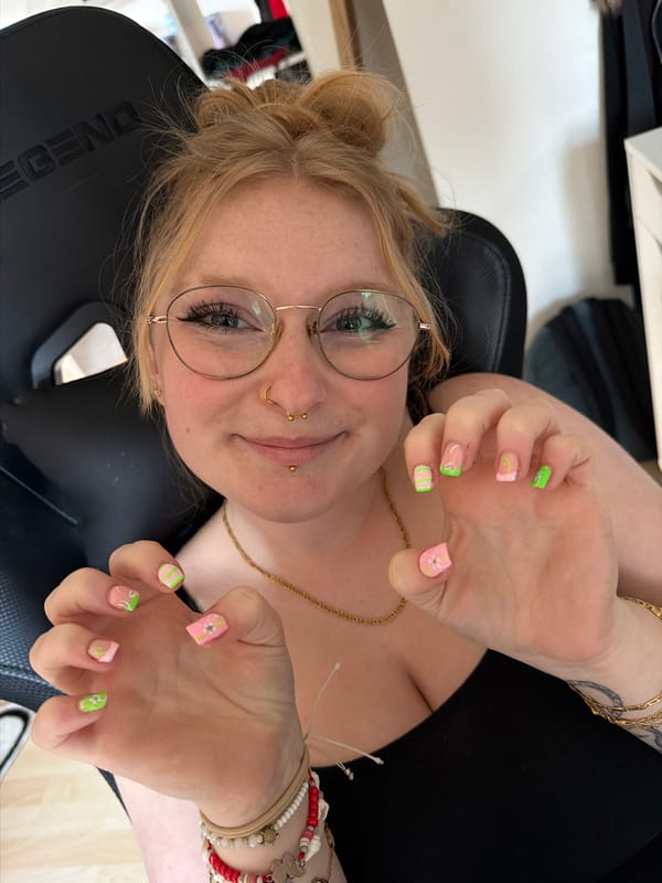 Woman with piercings sits in gaming chair in Trassem