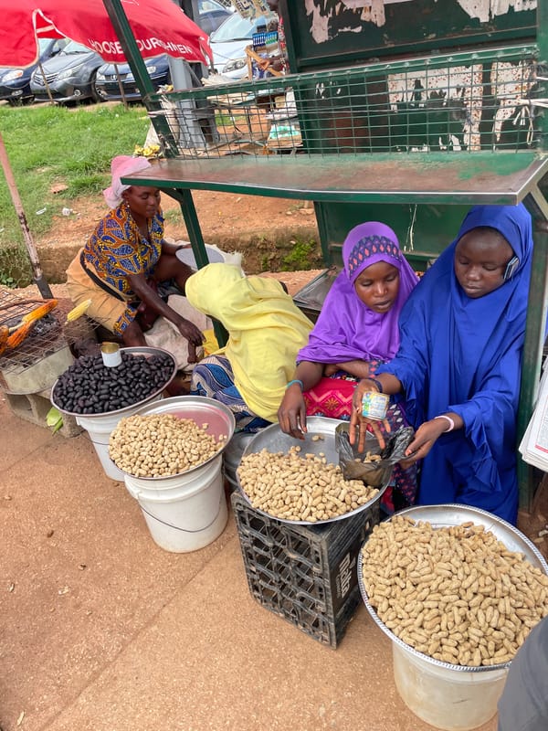 Roadside market and traffic scene in Bar Jirgi Summa, Nigeria