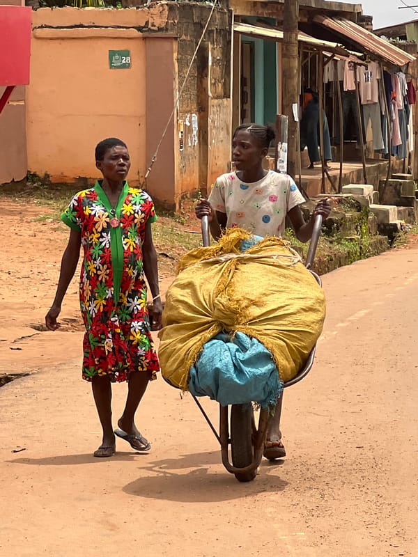 Everyday street life along a busy road in Nkpor, Nigeria
