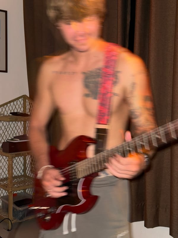 Late-night guitar session in a coastal Sri Lanka room