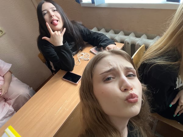 Young women's casual classroom gathering documented in Sterlitamak