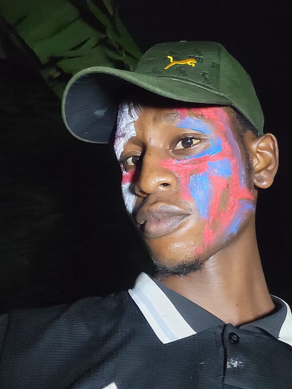 Man in patriotic face paint photographed in Nkpor, Nigeria