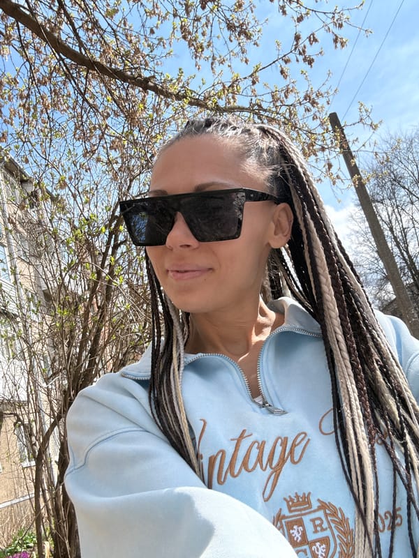 Person captures outdoor selfie with braided hair April 17