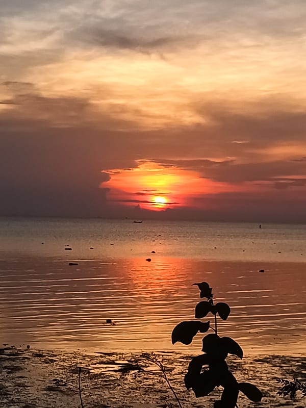 Sunset meditation captured at Thai coastal village Monday morning