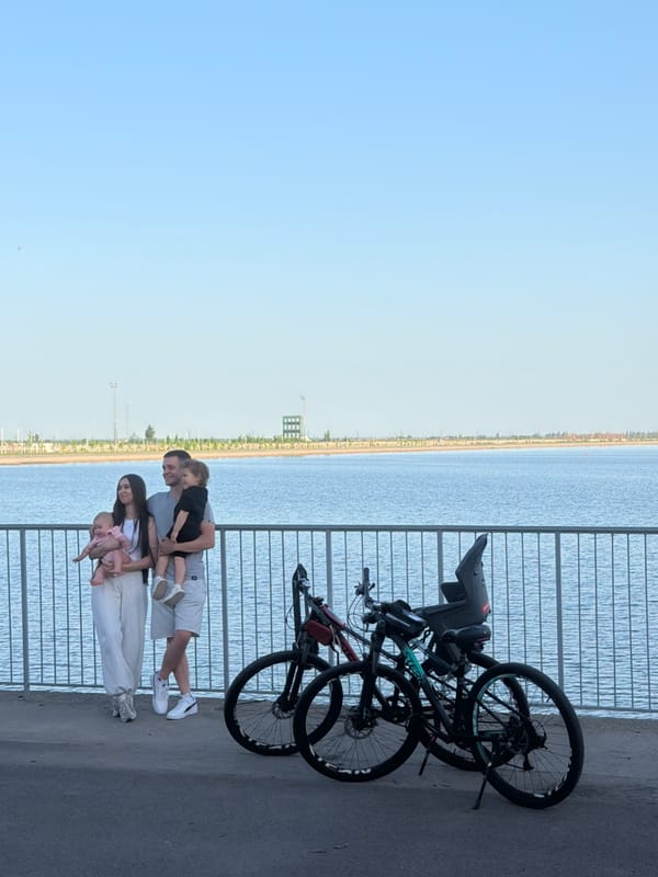 Family enjoys afternoon outing at Rostov-on-Don embankment with bicycles