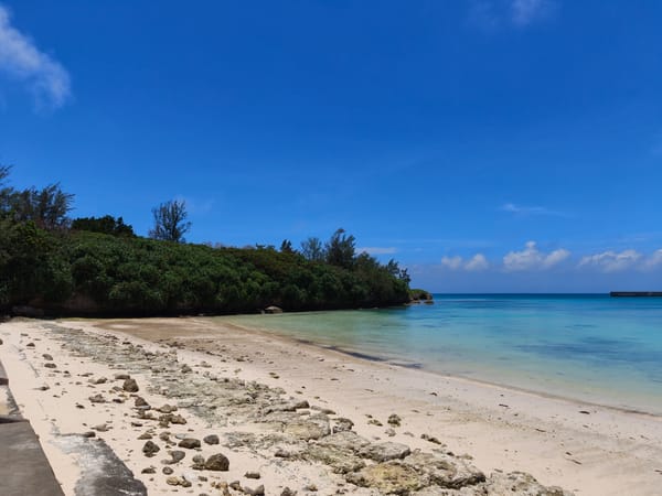 Calm turquoise shoreline on a clear day in Miyakojima