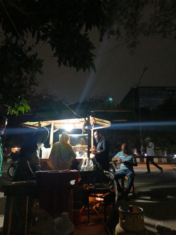 Evening street food vendor operates in Dhaka