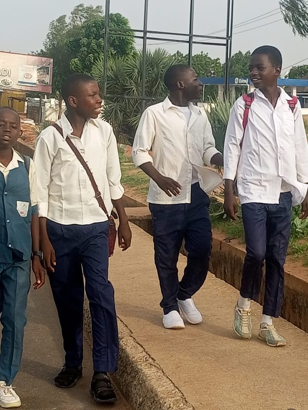 Morning school commute across two Nigerian towns