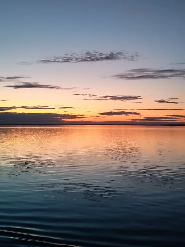 Maritime sunrise captured from cargo ship deck in Russia