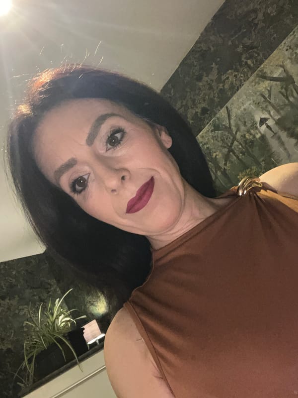 Woman photographed with cat on marble surface in Konz