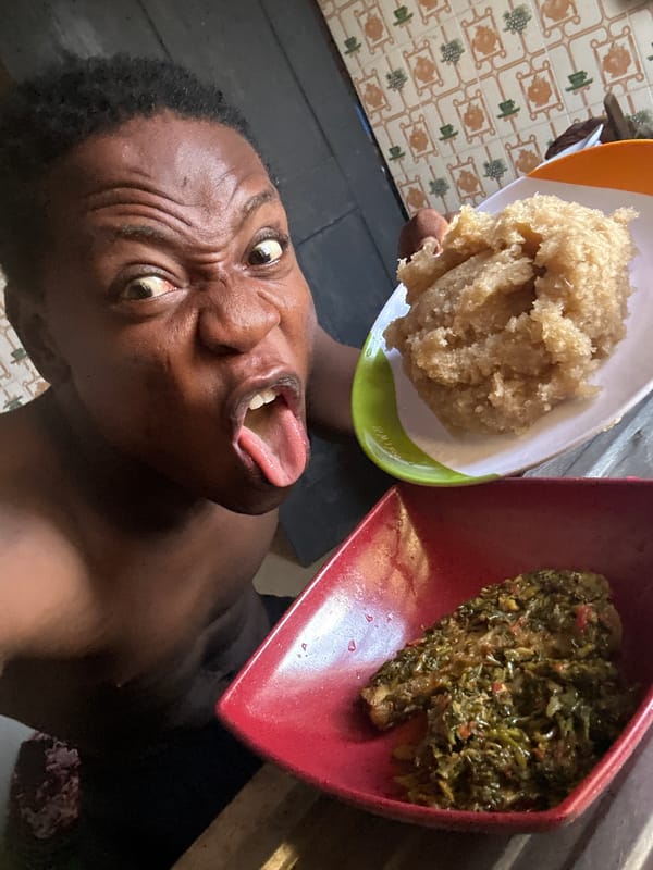 Person eating traditional meal while children gather in nearby schoolyard