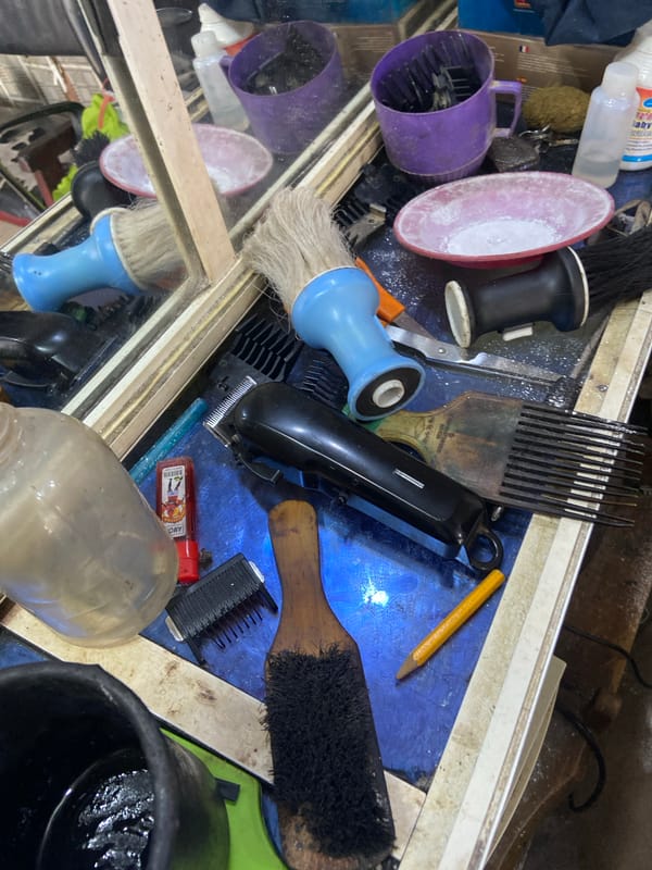 Morning at a barbershop in Kuson, Nigeria