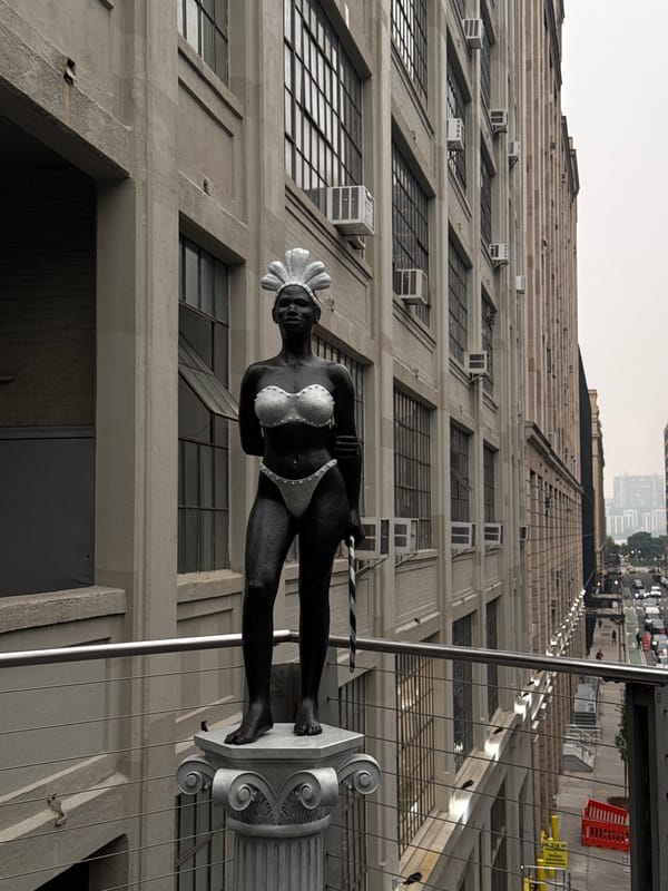 Metal statue on a NYC balcony, headdress and bikini detail