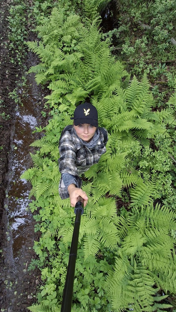 Person documents forest walk with selfies in Innolovo