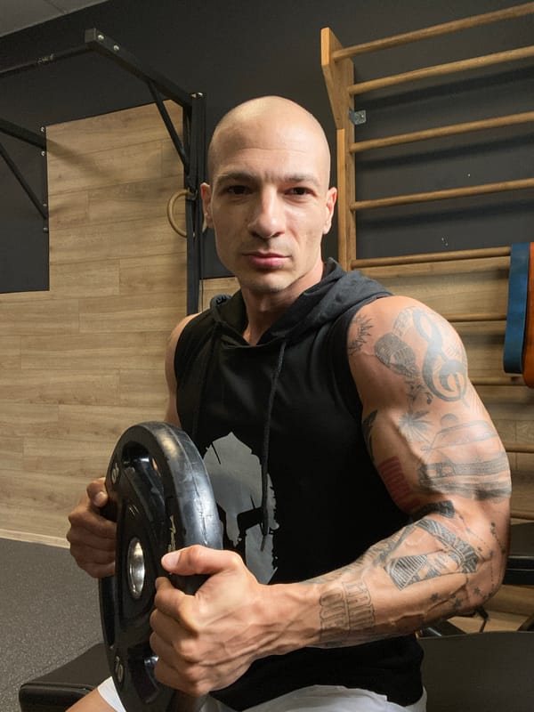 Tattooed man photographed at gym facilities in Pleven, Bulgaria