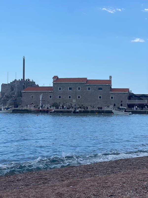 Sunny beach day draws families to Montenegro's Petrovac shores