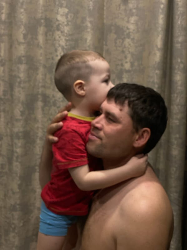 Father and toddler share morning routine in Sochi home