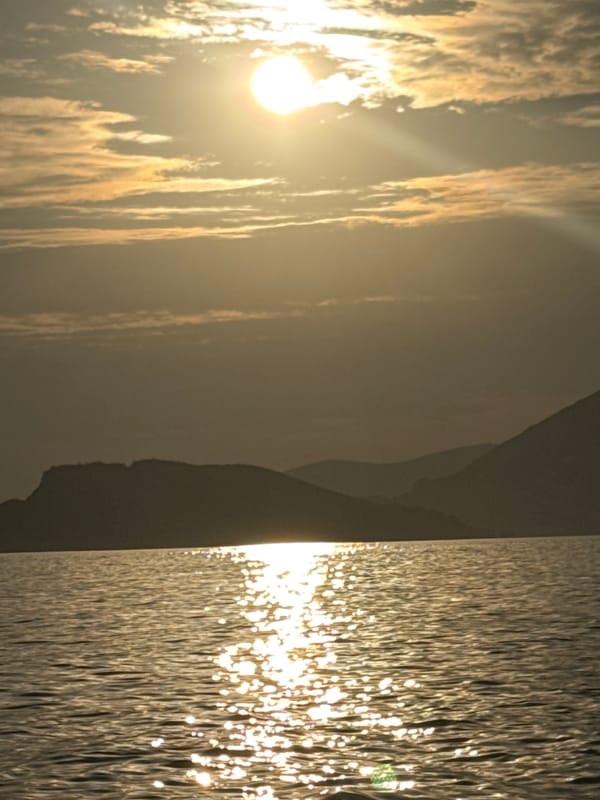 Golden hour on the Adriatic: parasailing and rocky shoreside calm