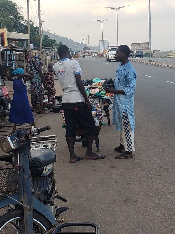 Street vendors conduct business in Lokoja, Nigeria afternoon markets