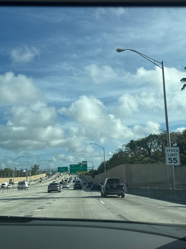 Miami highway shows moderate traffic under clear skies
