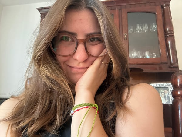 Woman documents video editing session with playful poses in Puebla