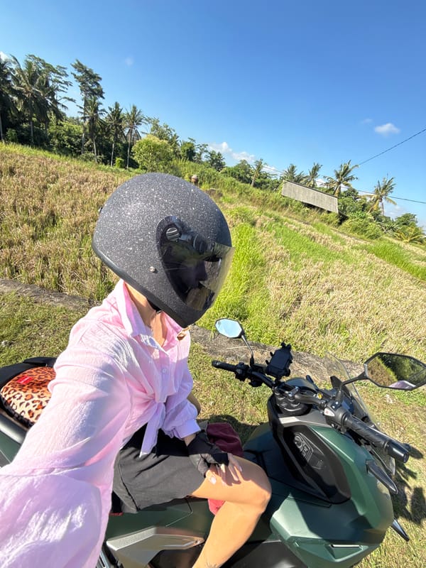 Scooter rider spotted in Ubud rice fields, Indonesia