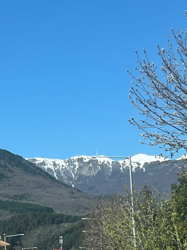 Clear skies reveal snow-capped mountains in Goce Delcev, Bulgaria