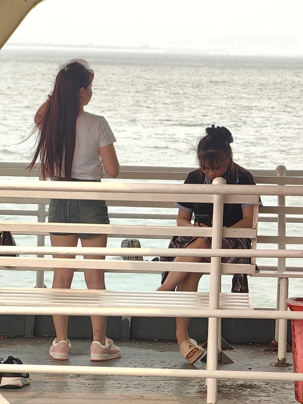 Tourist photographed on boat in Ha Long Bay morning