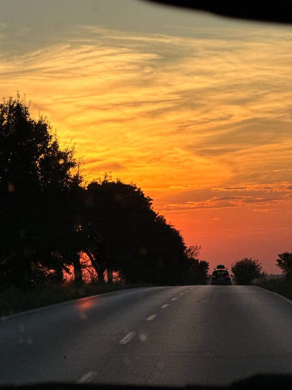 Fiery Bulgarian sunset through a windshield near Zgalevo