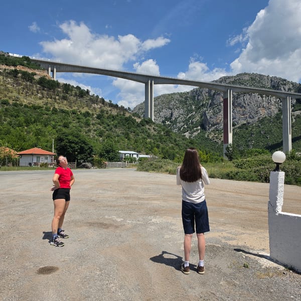 Tourists photograph at Moračica Bridge in Montenegro mountains