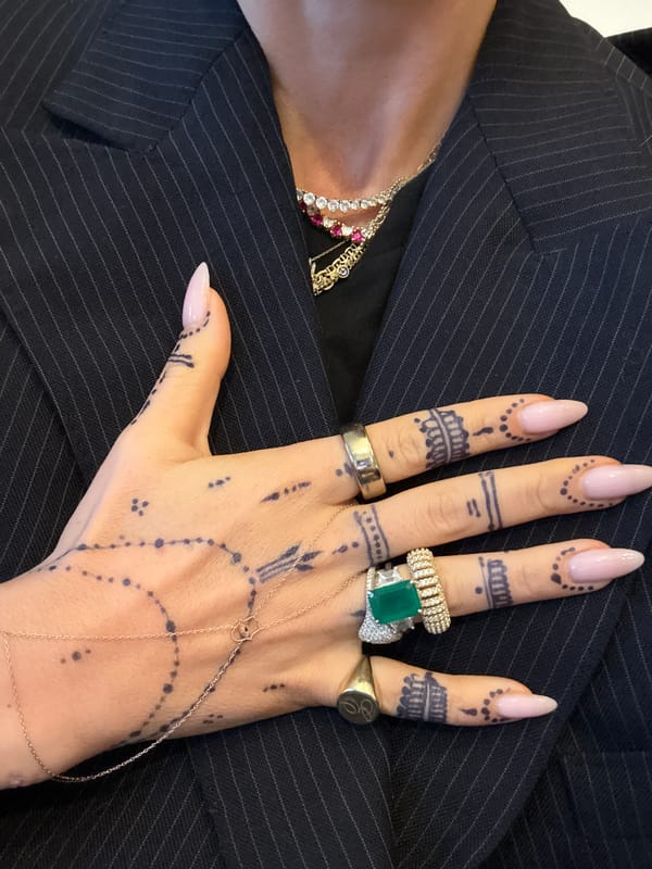 Woman shows off henna tattoos and rings in London