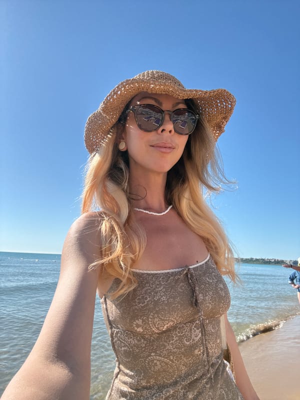 Woman takes morning selfies on Nesebar beach