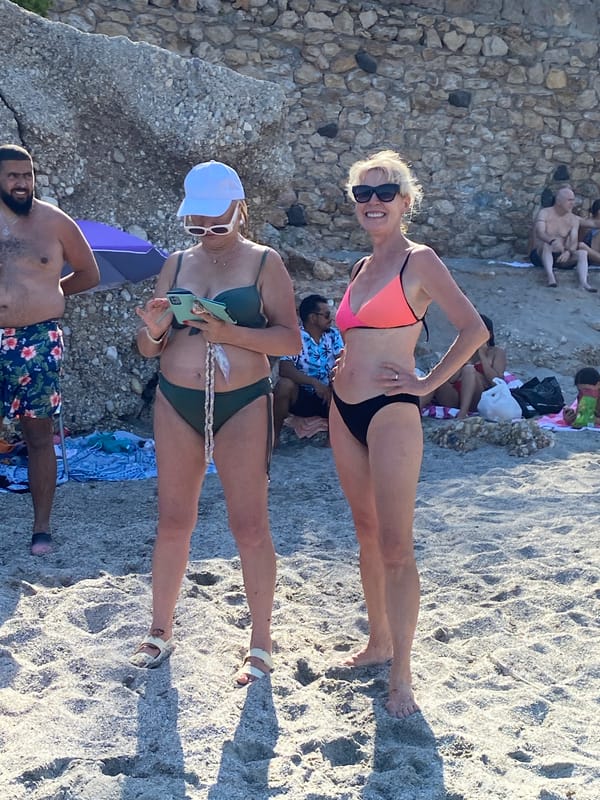 Busy summer afternoon on Nerja's pebble and sand beaches