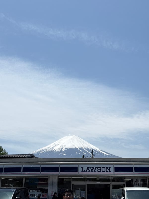 Clear day view of Mount Fuji behind Lawson store