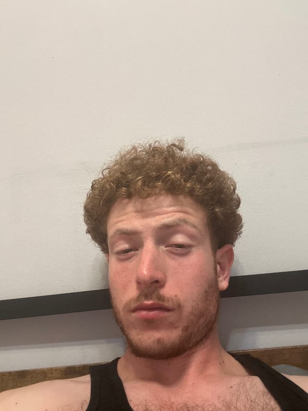 Man in black tank top spotted indoors in Manhattan