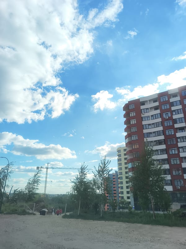 People gathered along dirt road in Ternopil, Ukraine
