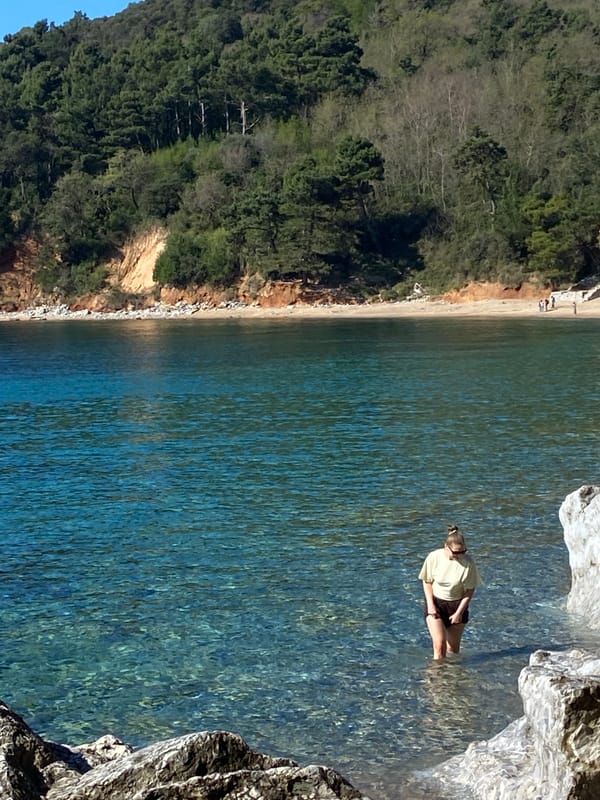 Morning beach activity captured along Montenegro's rocky Budva coastline