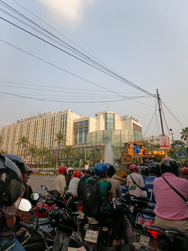 Street art murals draw crowds on Dhaka sidewalk