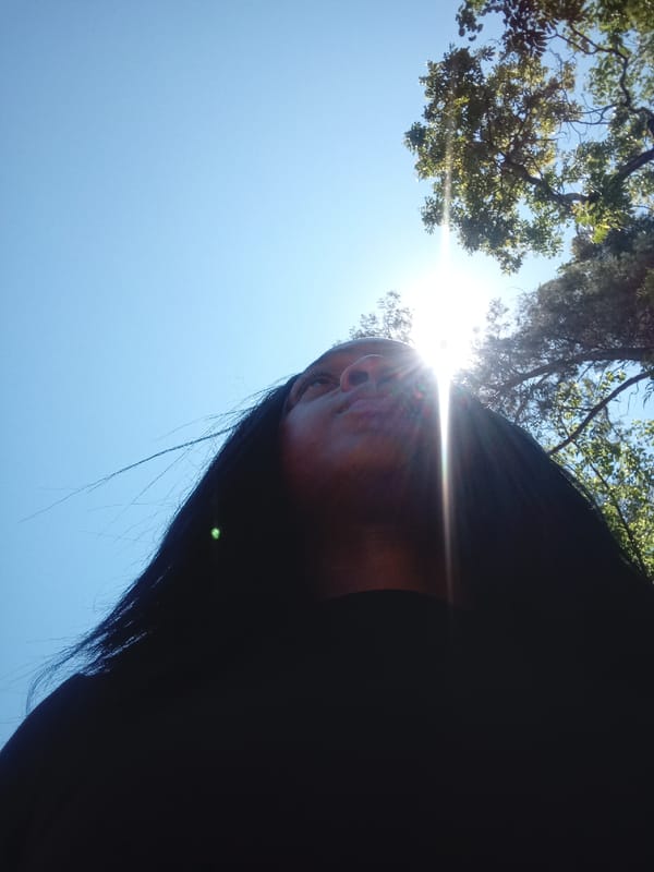 Person photographed looking skyward in Mahiakalo ward, Kenya