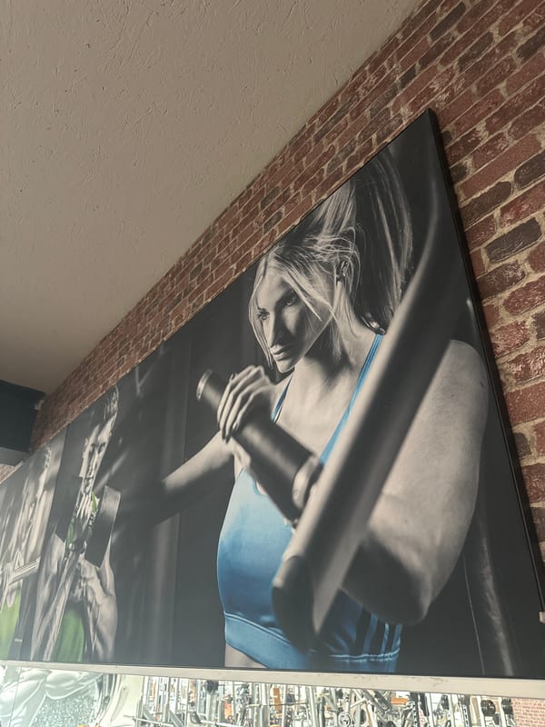 Fitness poster with blue accent spotted on Brunnthal wall