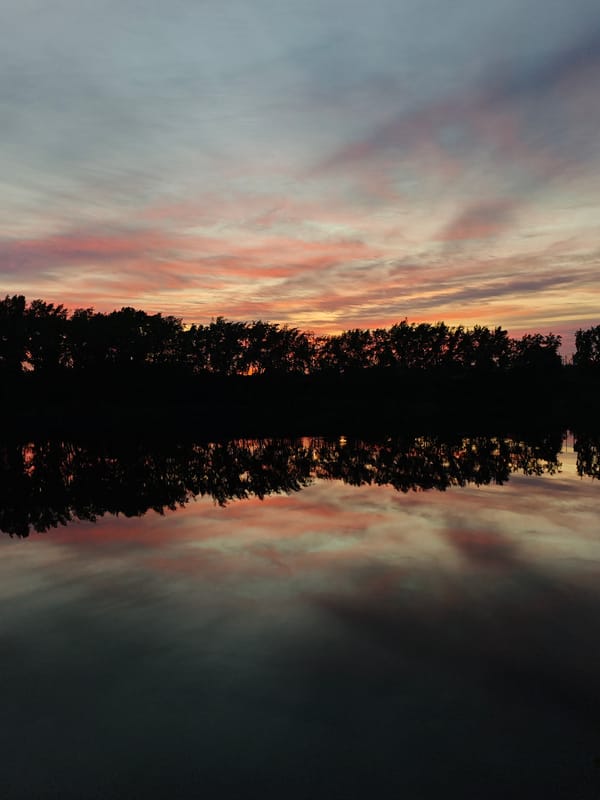 Sunset observed over water in Chaikovsky, Russia