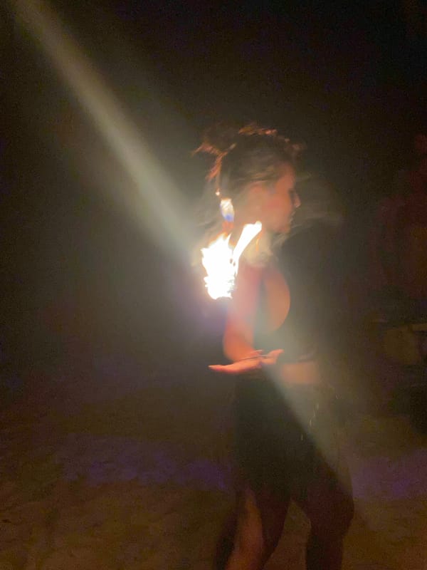 Beach bar nightlife with fire performance captured in Thailand