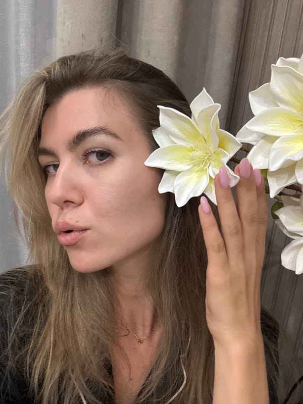 Laid-back home shoot with flowers, pajamas, and chocolate.