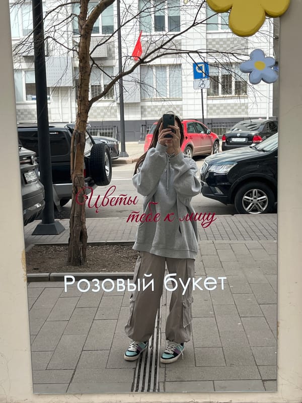 Woman takes mirror selfie in Krasnoyarsk early morning