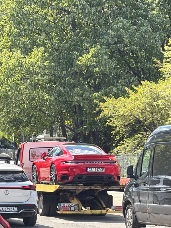 Red Porsche towed on Sofia street