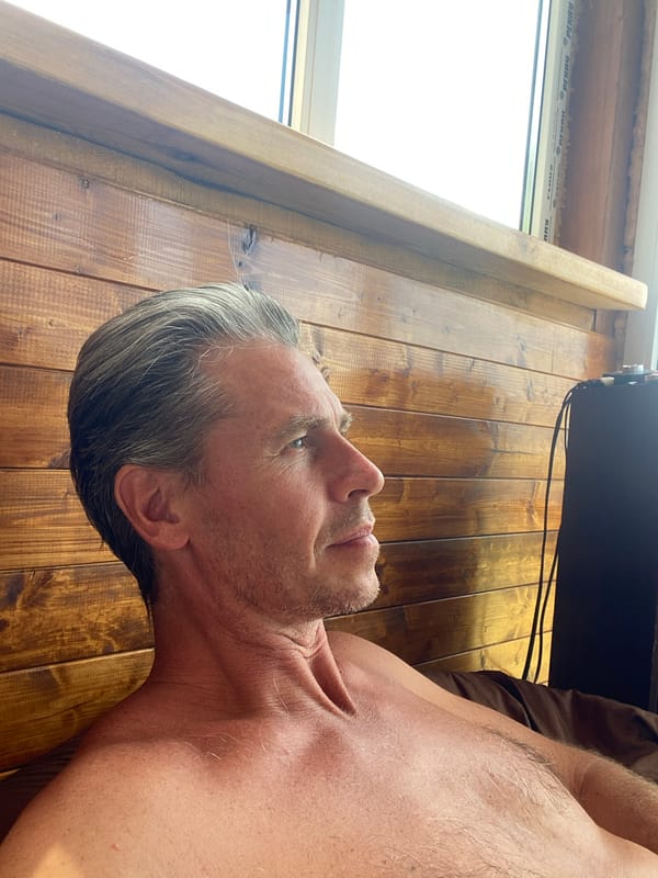 Slow morning in a Crimean cabin with a book and bare feet