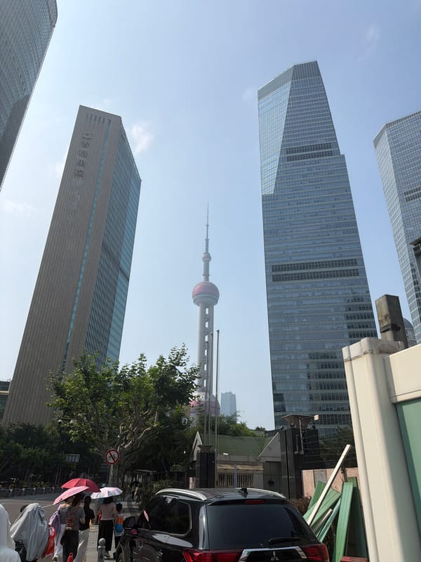 Pudong skyline and streets on a sunny July morning