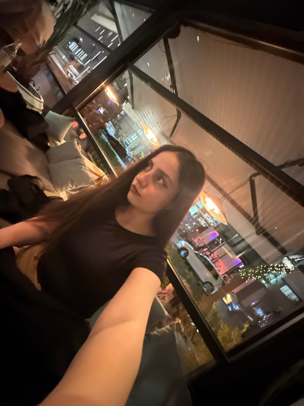 Man poses with golden doodle dog in Yerevan